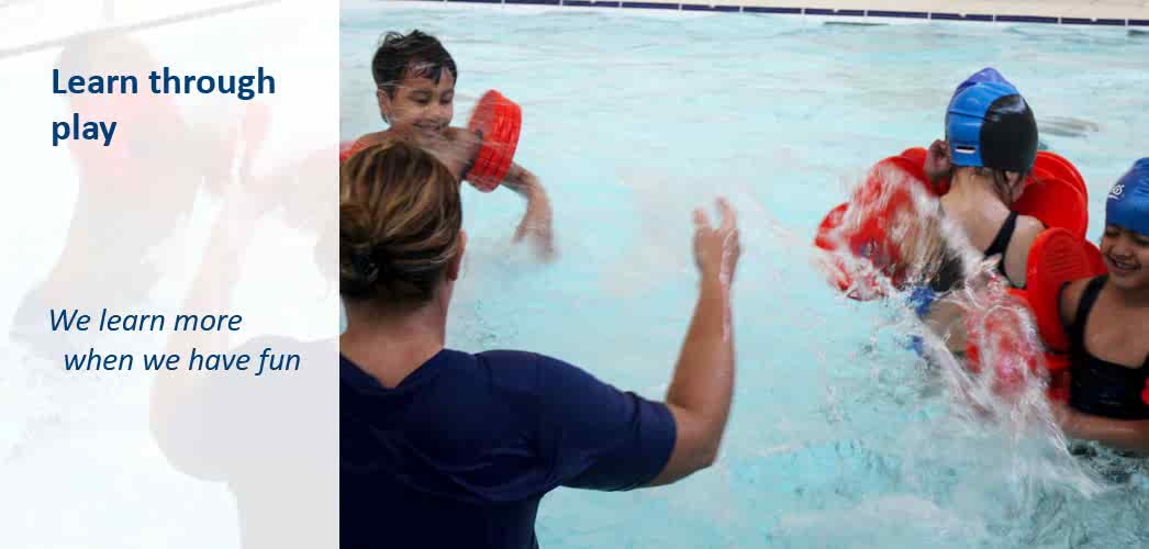 Swimming teacher in swimming pool with kids